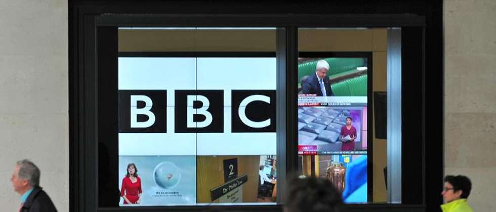 A BBC logo is pictured on a television screen inside the BBC's New Broadcasting House office in central London, on November 12, 2012 - Photo: Carl Court /AFP