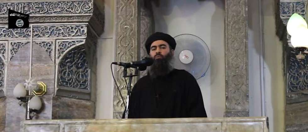 An image grab from a video released on July 5, 2014 by al-Furqan Media is said to show Abu Bakr al-Baghdadi addressing Muslim worshippers at a mosque in Mosul ( Al-Furqan Media/AFP )