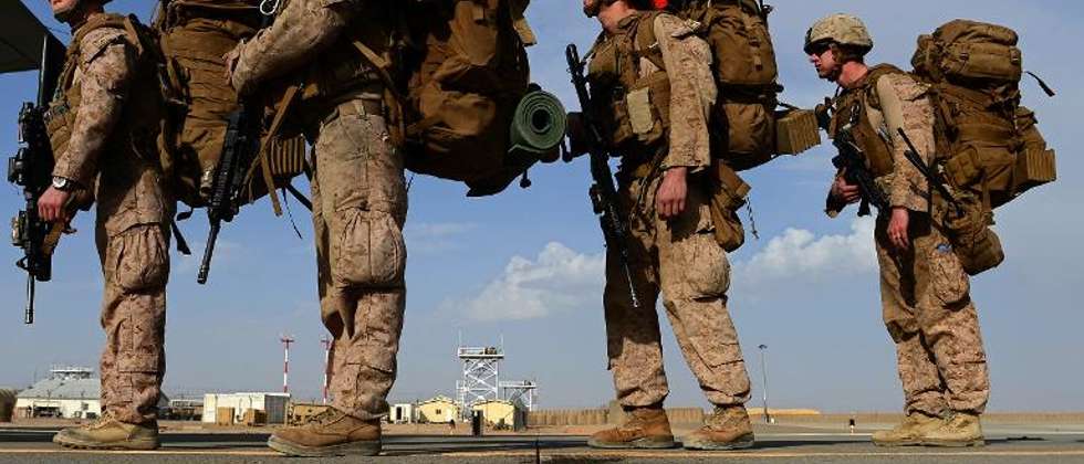 US Marines board a plane to Kandahar as British and US forces withdraw from the Camp Bastion-Leatherneck complex in Afghanistan's Helmand province in October 2014 ( Wakil Kohsar (AFP/File) )