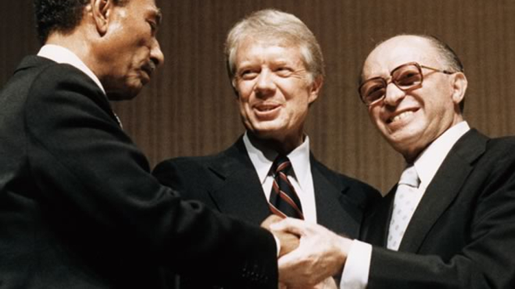 Presidents Anwar Sadat (R) and Jimmy Carter and Israeli PM Menachem Begin at signing of Israel-Egypt peace agreement