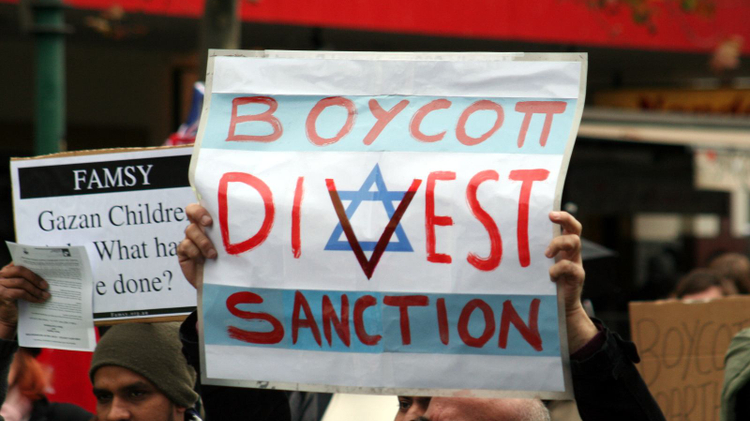 Des manifestants demandant un boycott contre Israël