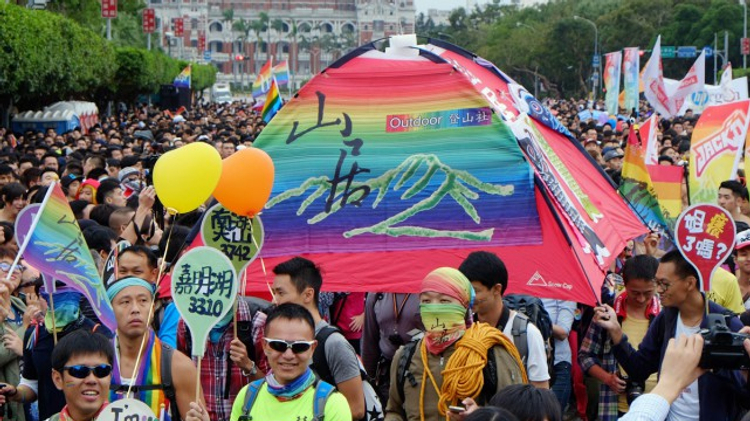 Participants carry a tent to mark their home during the annual gay parade in Taipei on October 31, 2015