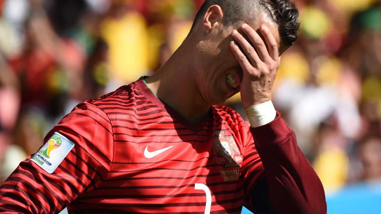 Portugal's forward and captain Cristiano Ronaldo reacts during the Group G football match between Portugal and Ghana at the Mane Garrincha National Stadium in Brasilia during the 2014 FIFA World Cup on June 26, 2014