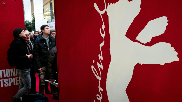 Spectators queue for tickets to the Berlinale film festival, February 8, 2016