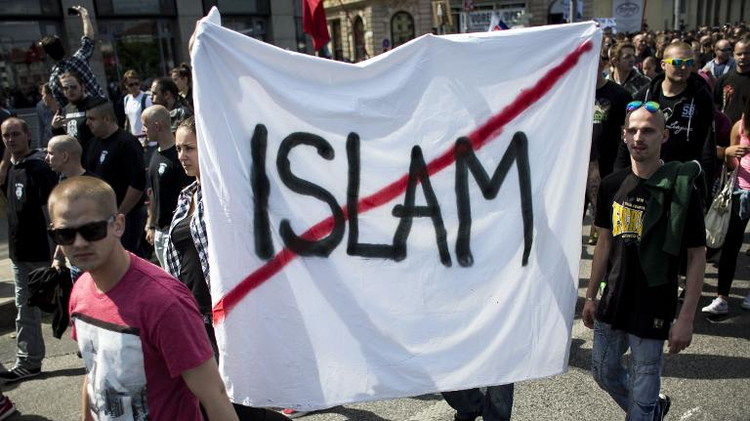 Participants hold a banner during an anti-immigration rally organised by an initiative called "Stop Islamisation of Europe" in Bratislava, Slovakia on June 20, 2015