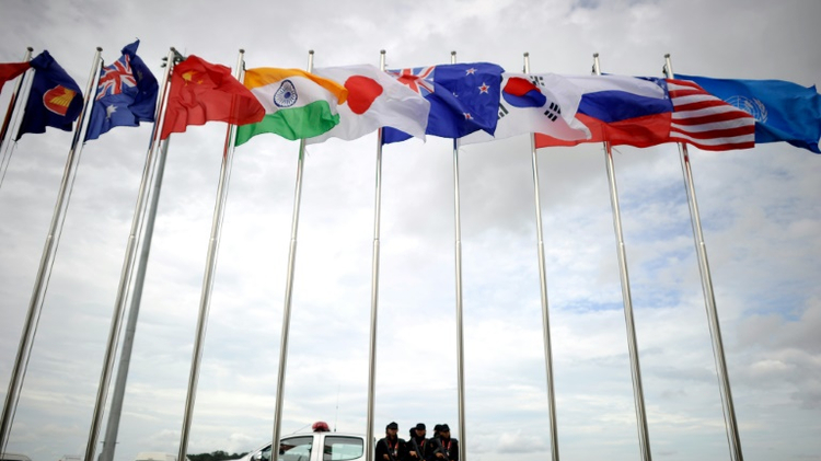 Security personnel wait for the arrival of Malaysia's Prime Minister Najib Razak's private aircraft at the Wattay International Airport in Vientiane, on September 5, 2016