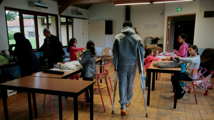 Des réfugiés dans un centre d'accueil à Cergy le 16 septembre 2015