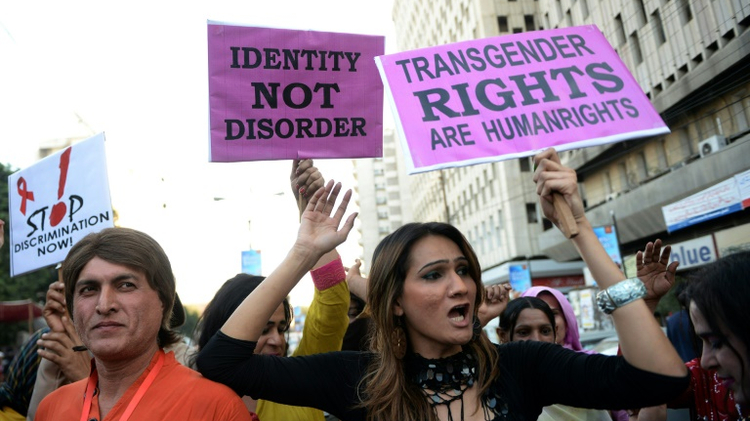 Pakistani transgenders carry signs at a rally in Karachi on November 30, 2013