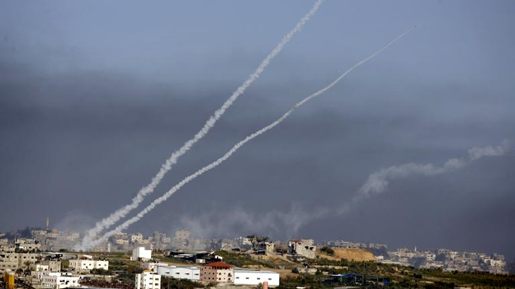 Smoke trails rise up into the sky after rockets were launched toward southern Israel from the town of Beit Hanun in the northern Gaza Strip, on January 4, 2009