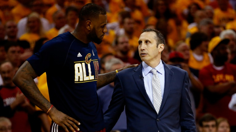 LeBron James of the Cleveland Cavaliers and David Blatt speak in the fourth quarter against the Atlanta Hawks on May 26, 2015 in Cleveland, Ohio