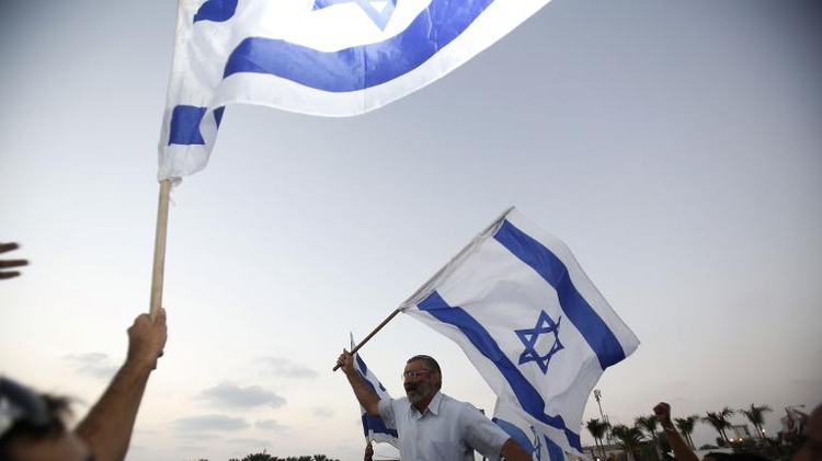 Members of far-right organization Lehava protest outside a wedding between a Muslim man and a Jewish woman, Rishon LeZion, August 17, 2014