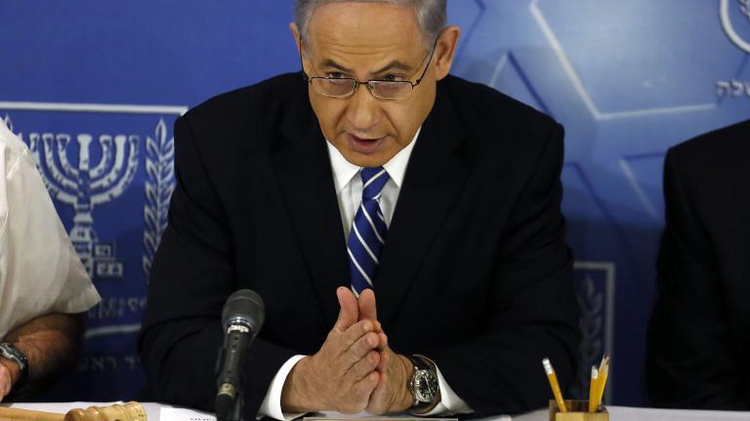 Israeli Prime Minister Benjamin Netanyahu speaks as he opens the weekly cabinet meeting at the Defense Ministry in the costal city of Tel Aviv on August 24, 2014