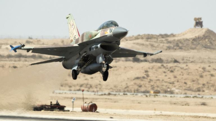 An F-16 warplane takes off from the Ramon Air Force base in the Negev Desert, southern Israel, on October 21, 2013