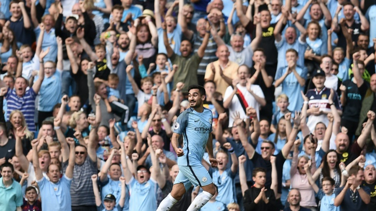 Manchester City's German midfielder Ilkay Gundogan celebrates scoring their fourth goal during the English Premier League football match between Manchester City and Bournemouth