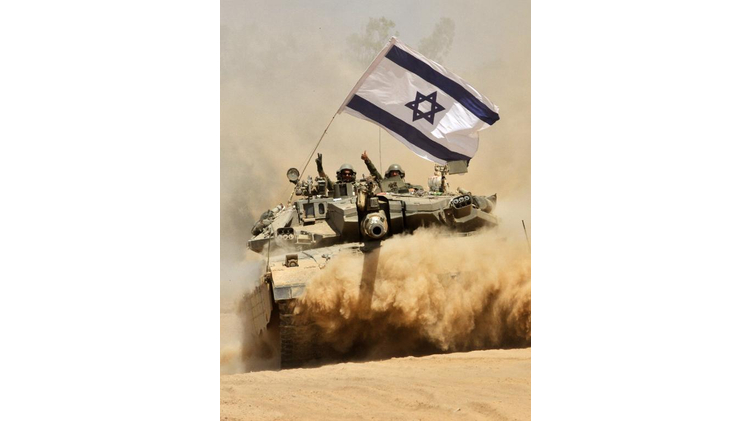 Israeli soldiers celebrate on their Merkava tank as they pull out of the Gaza Strip, on August 3, 2014