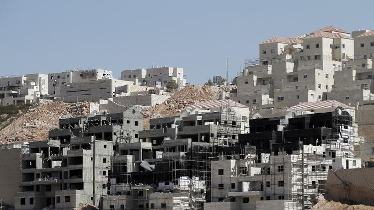 Buildings under construction are seen in the Israeli settlement of Beitar Illit near the Palestinian West Bank village of Wadi Fukin, on September 4, 2014