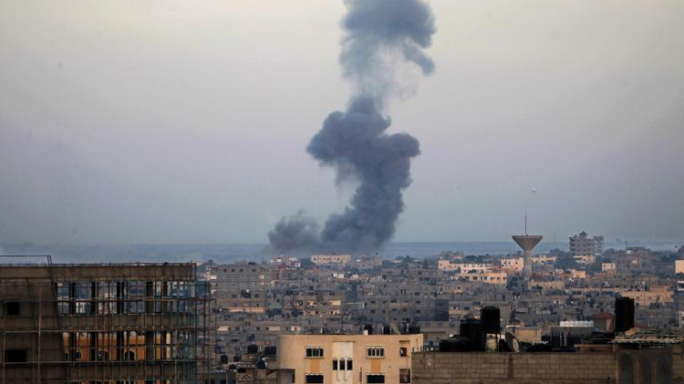 Smoke billows from buildings following an Israeli air strike in Rafah, in the southern Gaza Strip, on July 31, 2014