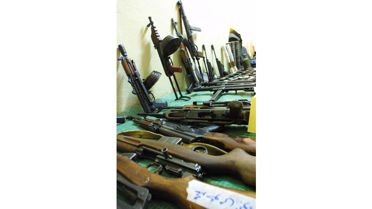 Weapons and ammunition seized by the Jordanian security forces during a hunt for wanted "outlaws" are collected at the central police station in Amman on November 15, 2002