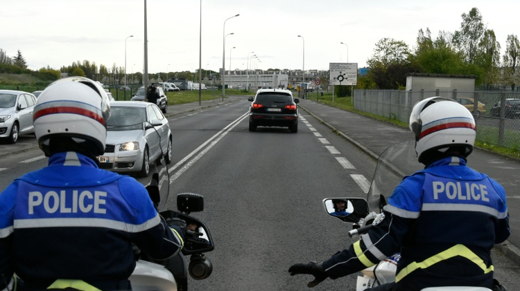 French police officers escort Paris attacks suspect Salah Abdeslam to the Fleury-Merogis prison in April 2016