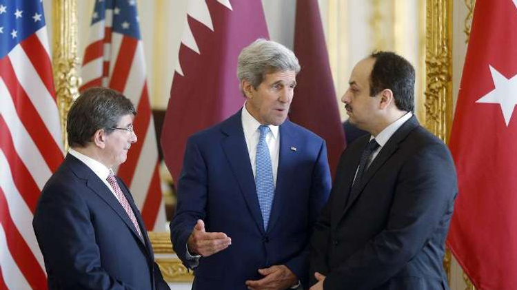 (From L) Turkish Foreign Minister Ahmet Davutoglu, US Secretary of State John Kerry and Qatari Foreign Minister Khaled al-Attiyah speak after their meeting, on July 26, 2014, at the foreign ministry in Paris