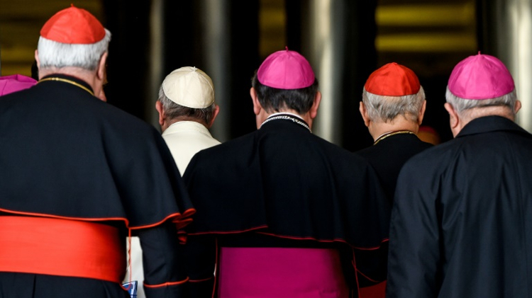 Pope Francis (2-L) arrives with bishops and cardinals for the morning session on the last day of the Synod on the Family at the Vatican on October 24, 2015