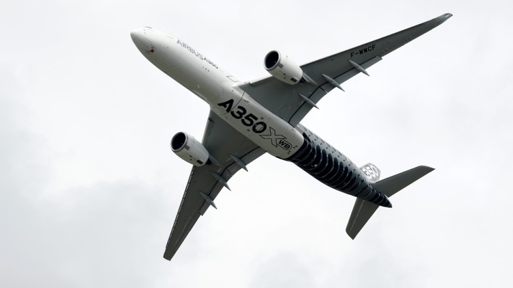 The Airbus A350 jet airliner takes part in a flying display at the Farnborough Airshow, south west of London, on July 12, 2016
