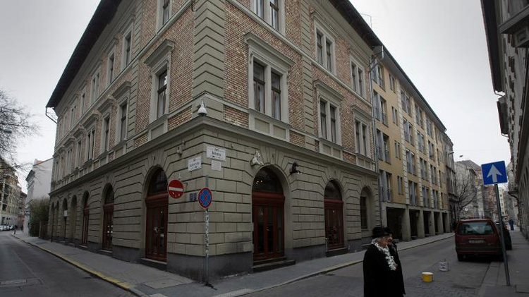 An older couple crosses Dob street, the former Ghetto during WWII in Budapest, Hungary on January 27, 2013