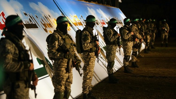Palestinian members of the Ezzedine al-Qassam Brigades, the armed wing of the Hamas movement, take part in a gathering in Gaza city