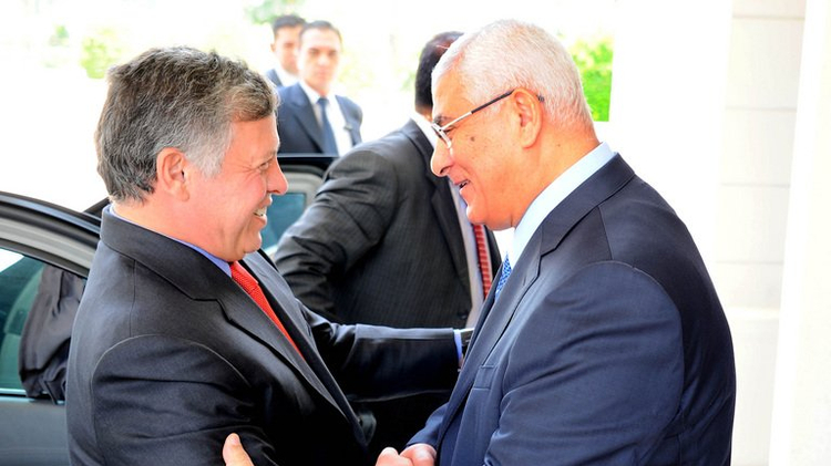Egypt's Interim President Adly Mansour welcomes Jordan's King Abdullah II in Cairo, on July 21, 2013