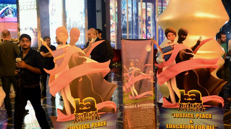 Media gather at the press preview of cartoon show "Burka Avenger" in Rawalpindi on August 4, 2013