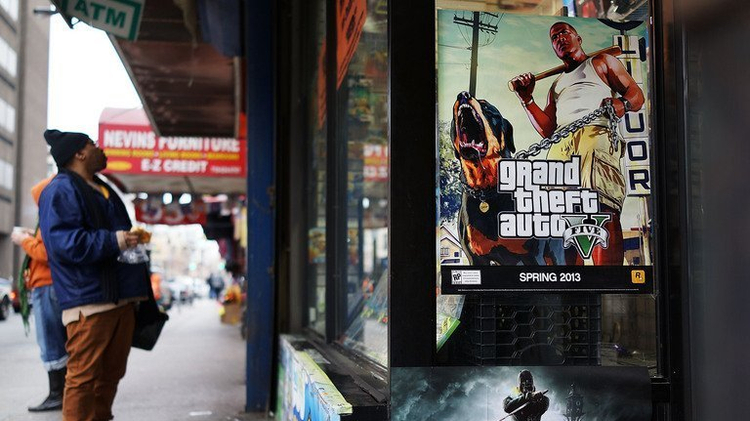 An advertisement for the new Grand Theft Auto displayed outside of a gaming store on January 11, 2013 in New York City