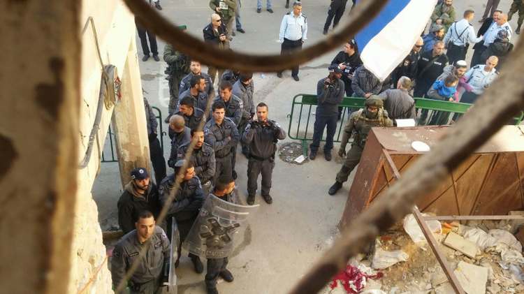 Israeli security forces prepare to evacuate a group of Jewish settlers from two homes in a Palestinian neighborhood of Hebron on January 22, 2016