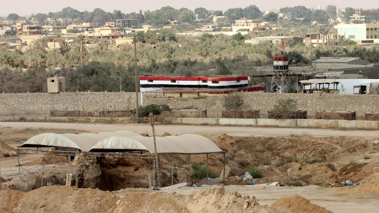 Tents cover entrances of tunnels (bottom) used for smuggling along the Gaza-Egypt border, near the southern Gaza Strip town of Rafah on August 6, 2012