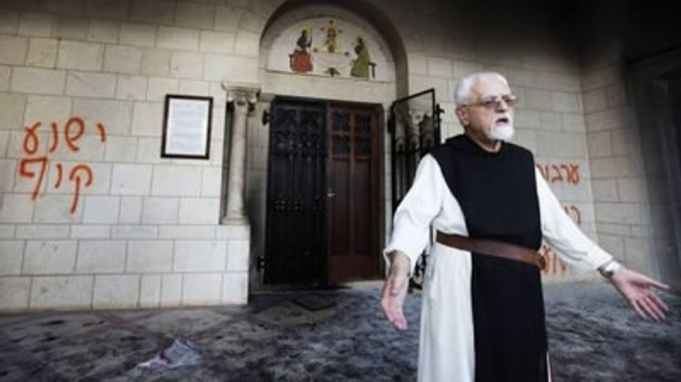 Monk at Latrun monastery in Israel after hate graffiti was painted on the walls (April 2014)