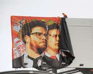 Workers remove a poster-banner for "The Interview" from a billboard in Hollywood, California, December 18, 2014 ( Michael Thurston (AFP/File) )