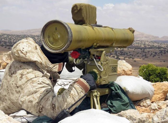 A Hezbollah fighter patrols the Qalamun hills close to the Lebanese border with Syria Hezbollah Press Office/AFP