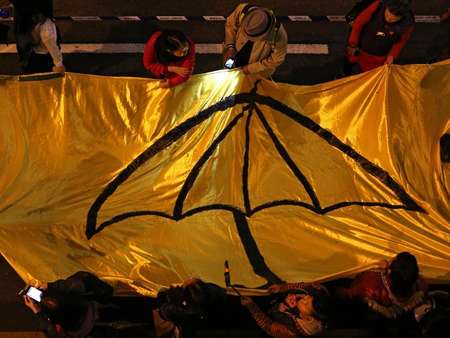 Hong Kong democracy groups take to streets as key vote looms.