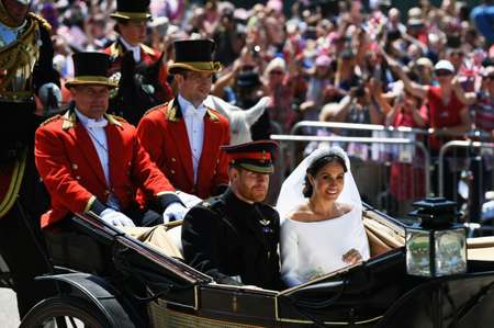 The royal couple rode in a horse-drawn carriage through Windsor after the wedding ( Jeff J Mitchell (POOL/AFP) )