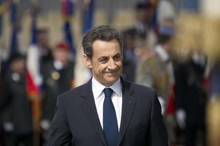 Then French president Nicolas Sarkozy takes part in a ceremony marking the 67th anniversary of the Allied victory over Nazi Germany in World War II, on May 8, 2012 at the Arc de Triomphe in Paris - Lionel Bonaventure (AFP/File) Lionel Bonaventure (AFP/File)