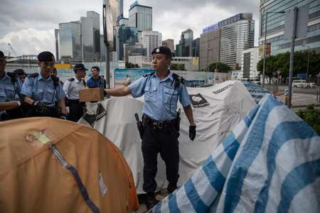 Hong Kong democracy groups take to streets as key vote looms.