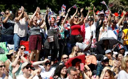 Well-wishers cheered as they watched the wedding on a giant screen ( Tolga AKMEN (AFP) )