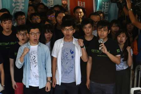 Joshua Wong Nathan Law and Alex Chow were sentenced to six months eight months and seven months jail respectively in Hong Kong Thursday