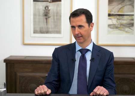 A picture released on March 27, 2015 by the official Syrian Arab News Agency (SANA) shows Syrian President Bashar al-Assad giving an interview to journalists from various Russian media outlets in the Syrian capital Damascus - SANA/AFP SANA/AFP