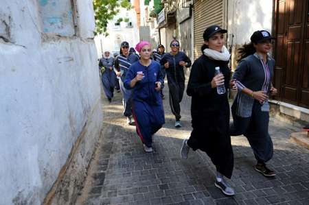 Sports abayas still envelop the female form but offer greater movement than the classic baggy version whose flowing hemline would be a handicap ( Amer HILABI (AFP) )