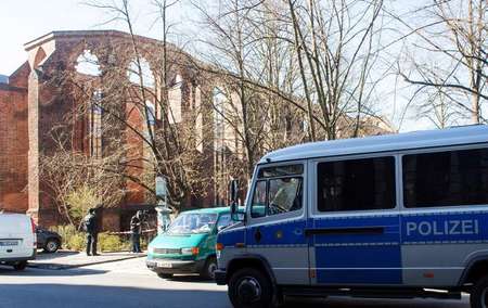 Police cars stand in front of the ruins of the Franciscan Monastery in Berlin on April 5, 2015, where the body of an Israeli man was found ( Maurizio Gambarini (DPA/AFP/File) )