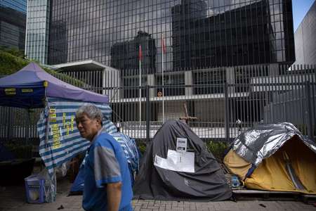 Hong Kong democracy groups take to streets as key vote looms.