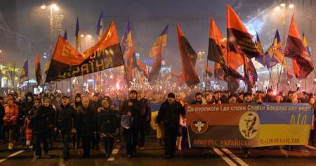 Thousands of Ukrainian nationalists hold a torchlight procession across Kiev on January 1, 2015 in honour of Stepan Bandera, a World War II anti-Soviet insurgent ( Genya Savilov (AFP) )
