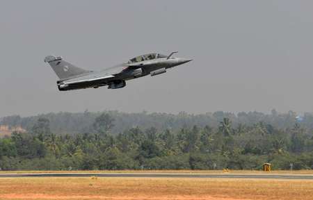 A Rafale multi-role combat aircraft from Dassault Aviation of France takes off at Yelahanka Airforce Station in Bangalore on February 18, on the inaugural day of Aero India 2015 ( Manjunath Kiran (AFP) )