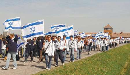 Israeli highschool students visiting the site of the Nazi death camp at Auschwitz - Israel Government Press Office Israel Government Press Office
