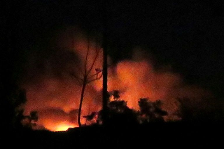Flames and smoke rise from the Mazzeh airbase on the outskirts of Damascus following what the Syrian army said were Israeli missile strikes AFP